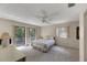 Bedroom with a double bed, two windows, and carpeted floors at 1400 Tarpon Woods Blvd # B5, Palm Harbor, FL 34685