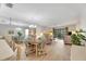 Bright dining area with wood table and seating for four, overlooking living room at 1400 Tarpon Woods Blvd # B5, Palm Harbor, FL 34685
