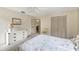 Bedroom with dresser and view into living room at 1400 Tarpon Woods Blvd # B5, Palm Harbor, FL 34685