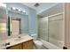 Bathroom with single vanity, bathtub and shower at 1400 Tarpon Woods Blvd # B5, Palm Harbor, FL 34685