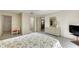 Bedroom with a dresser, TV and ensuite bathroom at 1400 Tarpon Woods Blvd # B5, Palm Harbor, FL 34685
