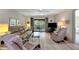 Open living area with sliding glass doors leading to balcony at 1400 Tarpon Woods Blvd # B5, Palm Harbor, FL 34685