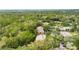 Aerial view showing home location in a wooded, residential community at 1400 Tarpon Woods Blvd # B5, Palm Harbor, FL 34685