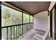 Spacious screened porch with a view of lush greenery at 1400 Tarpon Woods Blvd # B5, Palm Harbor, FL 34685
