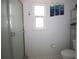 Clean bathroom featuring shower, toilet and window at 10698 117Th Way, Largo, FL 33778