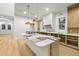 Modern kitchen with island, custom cabinetry, and gold lighting at 1803 Cedar St, Safety Harbor, FL 34695