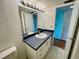 Bathroom with vanity sink, mirror, and tiled floor at 2525 W Bay Dr # B32, Largo, FL 33770
