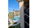 View from balcony overlooking the community pool and lush grounds at 2525 W Bay Dr # B32, Largo, FL 33770