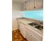 Kitchen with double sink, dishwasher, and ample counter space at 2525 W Bay Dr # B32, Largo, FL 33770