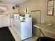 Shared laundry facility with coin-operated washers and dryers at 2525 W Bay Dr # B32, Largo, FL 33770