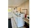 Shared laundry room with washers and folding area at 2525 W Bay Dr # B32, Largo, FL 33770