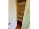 Linen closet with built-in shelves at 2525 W Bay Dr # B32, Largo, FL 33770