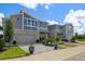 Modern townhouses with attached garages and landscaped yards at 31564 Woodland Race Loop, Wesley Chapel, FL 33545