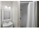 Clean bathroom with a shower/tub combo and white tile at 402 E Emma St, Tampa, FL 33603