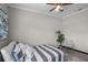 Serene bedroom with a striped bedspread and plenty of natural light at 402 E Emma St, Tampa, FL 33603