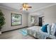 Charming bedroom with a bed, desk, and access to a nearby bathroom at 402 E Emma St, Tampa, FL 33603