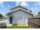 Gray house with teal door and storage shed at 402 E Emma St, Tampa, FL 33603