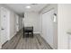 Hallway with gray walls, wood-look flooring, and a dining table at 402 E Emma St, Tampa, FL 33603
