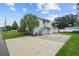 Two-story house with a private driveway and lush landscaping at 402 E Emma St, Tampa, FL 33603