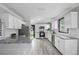 Modern kitchen with white cabinets, granite countertops, and stainless steel appliances at 402 E Emma St, Tampa, FL 33603