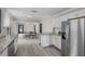 Modern kitchen with granite countertops and stainless steel appliances at 402 E Emma St, Tampa, FL 33603