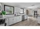 Modern kitchen with white cabinets and granite countertops at 402 E Emma St, Tampa, FL 33603