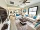 Open living room, kitchen and dining area, with light floors and a neutral color palette at 402 E Emma St, Tampa, FL 33603