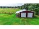 Metal barn with double doors and covered area at 5305 N Poel Rd, Plant City, FL 33565