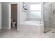 Spa-like bathroom with a large soaking tub and shower at 5305 N Poel Rd, Plant City, FL 33565