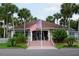 Community building with American flag and landscaping at 6450 Shoreline Dr # 9405, St Petersburg, FL 33708