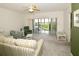 Living room with access to balcony and view of nature at 6450 Shoreline Dr # 9405, St Petersburg, FL 33708