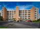 Exterior view of a condominium building with parking and landscaping at 6450 Shoreline Dr # 9405, St Petersburg, FL 33708