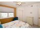 Bedroom with a queen bed, dresser, and window views at 6450 Shoreline Dr # 9405, St Petersburg, FL 33708