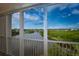 Balcony view of water, lush trees, and a clear sky at 6450 Shoreline Dr # 9405, St Petersburg, FL 33708