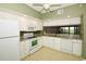 Well-equipped kitchen with white cabinets and granite countertops at 6450 Shoreline Dr # 9405, St Petersburg, FL 33708