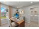 Home office with wood desk and laundry access at 31564 Woodland Race Loop, Wesley Chapel, FL 33545