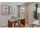 Home office with wood desk and window views at 31564 Woodland Race Loop, Wesley Chapel, FL 33545