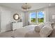 Bedroom with large windows offering a scenic view, and a spacious layout at 31564 Woodland Race Loop, Wesley Chapel, FL 33545