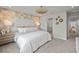 Main bedroom with ensuite bathroom and stylish wall decor at 31564 Woodland Race Loop, Wesley Chapel, FL 33545