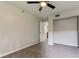 Bright bedroom featuring ceiling fan and neutral wall colors at 15215 Amberly Dr # 206, Tampa, FL 33647