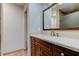 Bathroom featuring a vanity with granite countertop and large mirror at 15215 Amberly Dr # 206, Tampa, FL 33647