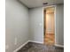 Well-lit bedroom with grey carpet and access to the bathroom at 15215 Amberly Dr # 206, Tampa, FL 33647