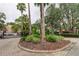 Community entrance with gate and landscaping at 15215 Amberly Dr # 206, Tampa, FL 33647