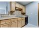 Modern kitchen with wood cabinets, granite countertops, and stainless steel appliances at 15215 Amberly Dr # 206, Tampa, FL 33647