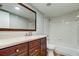 Clean bathroom with a vanity, toilet, and shower/tub at 15215 Amberly Dr # 206, Tampa, FL 33647