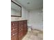 Well-lit bathroom with vanity, toilet, and shower/tub combo at 15215 Amberly Dr # 206, Tampa, FL 33647