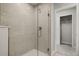 Bathroom with a walk-in shower and plenty of storage at 31556 Woodland Race Loop, Wesley Chapel, FL 33545
