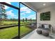 Relaxing screened porch overlooking the backyard and pond at 31556 Woodland Race Loop, Wesley Chapel, FL 33545