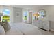 Bright bedroom with lake views and a large dresser at 31556 Woodland Race Loop, Wesley Chapel, FL 33545