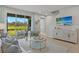 Spacious living area with comfy seating and large windows offering a view of the backyard at 31556 Woodland Race Loop, Wesley Chapel, FL 33545